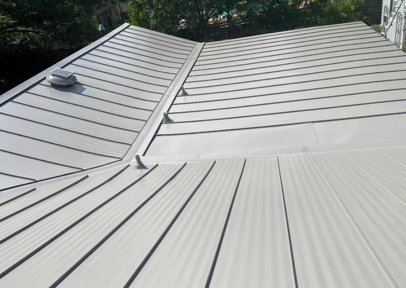Solar attic fan installed on a metal roof for Roof Ventilation in Conshohocken
